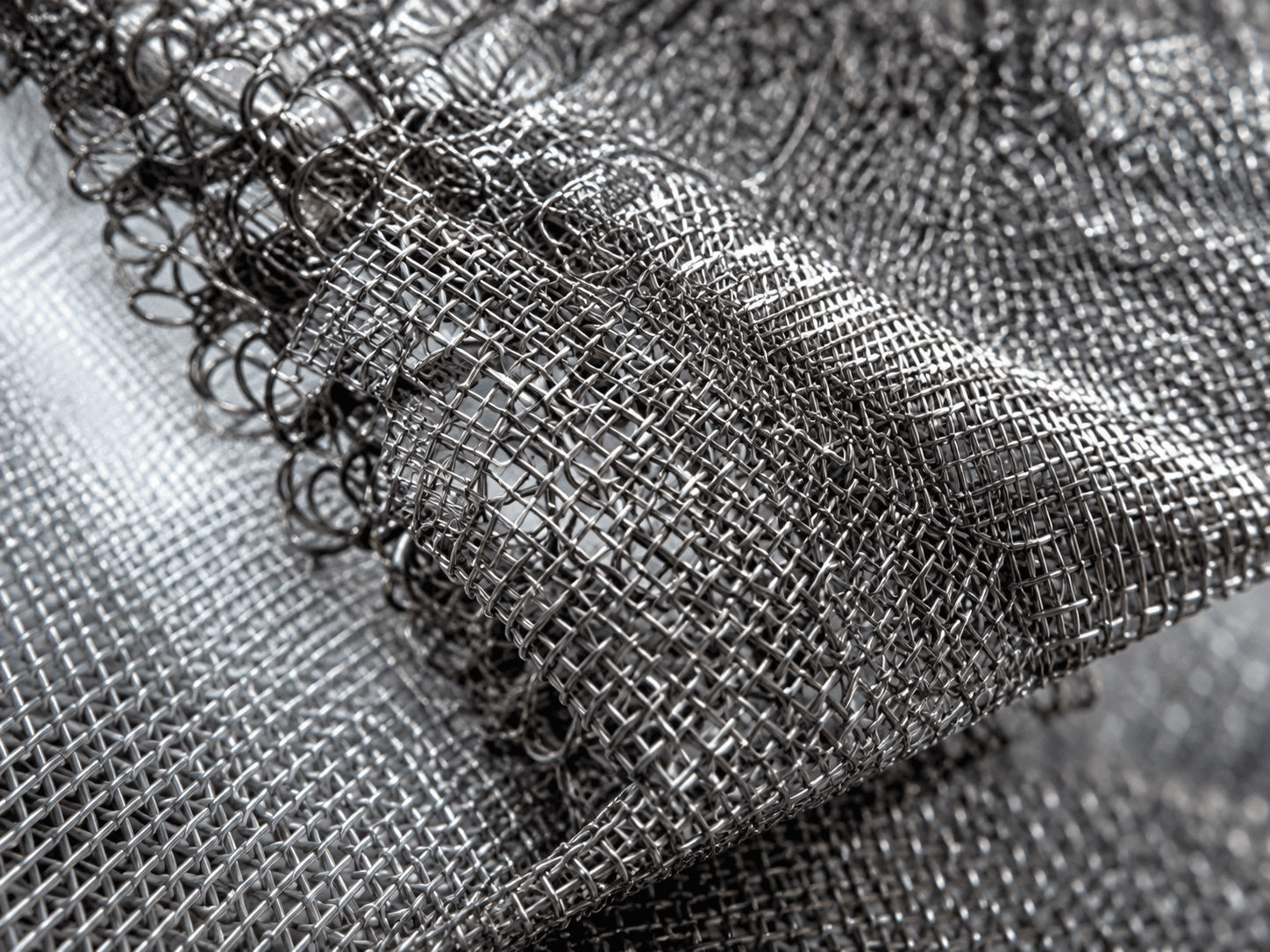 Illustration: Macro detail of knitted metal mesh structure